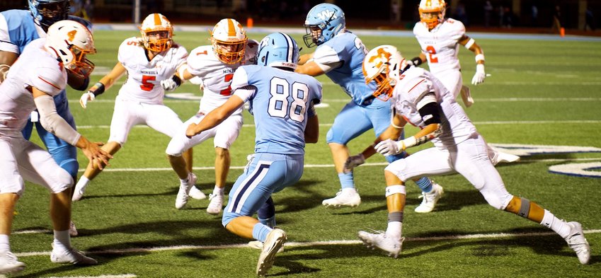 Mineola Yellowjackets, from left, Coy Anderson (4), Brady Shrum (5), Adam Blalock (7) and Julian Ramos (6) converge on the West Rusk ball carrier.