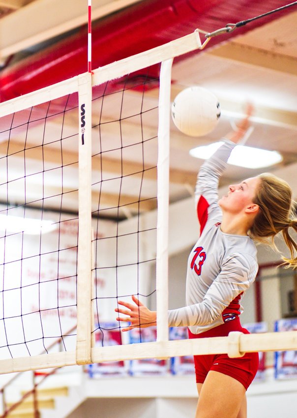 Cacie Lennon goes for a kill shot for the Alba-Golden Lady Panthers in action against Quinlan Boles Tuesday, Oct. 5.