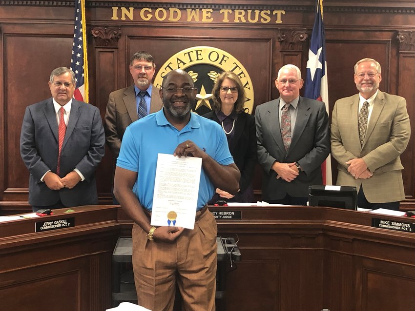 Wood County commissioners recently issued a proclamation honoring the St. Paul Missionary Baptist Church in Mineola upon reaching its 150th anniversary. Accepting was Pastor Demethrius Boyd, presented by, from left, Commissioners Virgil Holland and Jerry Gaskill, County Judge Lucy Hebron and Commissioners Mike Simmons and Russell Acker.